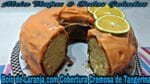 Bolo fofinho de laranja com cobertura cremosa.
